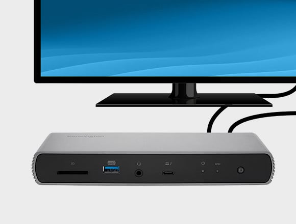 Front view of the Kensington SD5780T Thunderbolt™ 4K/6K Docking Station with external  HD monitor in background.