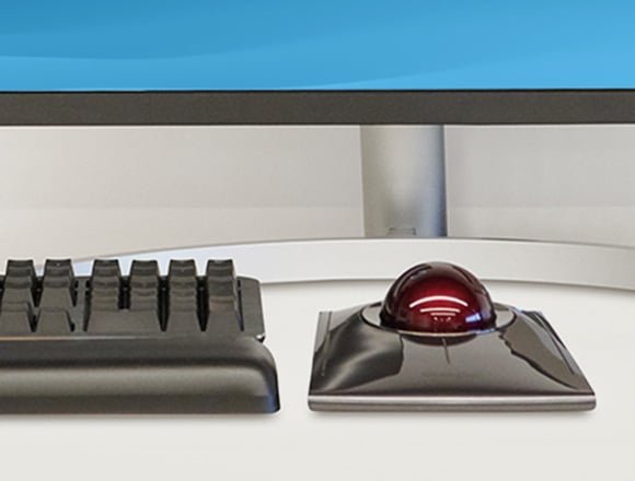 Close up of Kensington MK7500F QuietType™ Pro Silent Mechanical Keyboard and  SlimBlade™ Pro Trackball on a modern workstation.