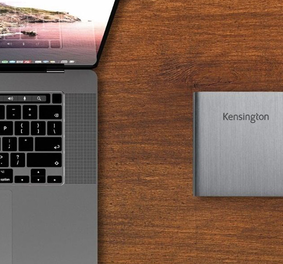 Kensigton Thunderbolt™ Docking Station next to a MacBook Pro.