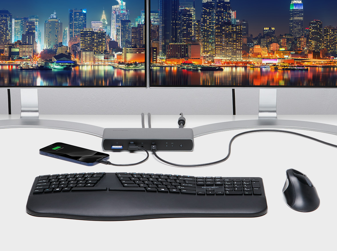 Modern workstation using the Kensington SD5780T Thunderbolt™ 4K/6K  Docking Station with up to 100W PD to charge a smartphone and connect to two external HD monitors.