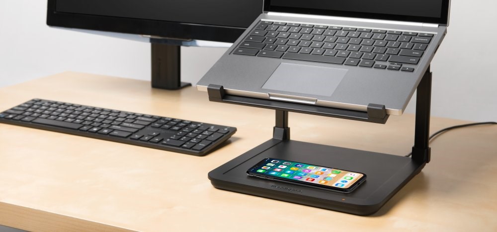 A Laptop paired with a Kensington® SmartFit® Laptop Riser with Qi Wireless Phone Charging Pad