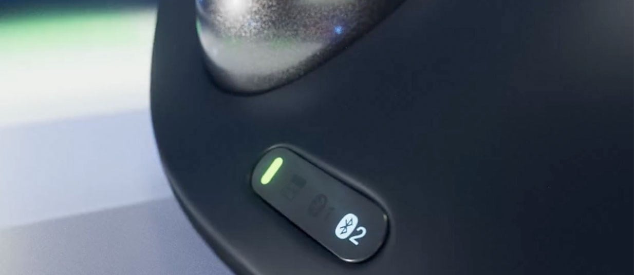 Close-up of a trackball with the focus on the connectivity light.