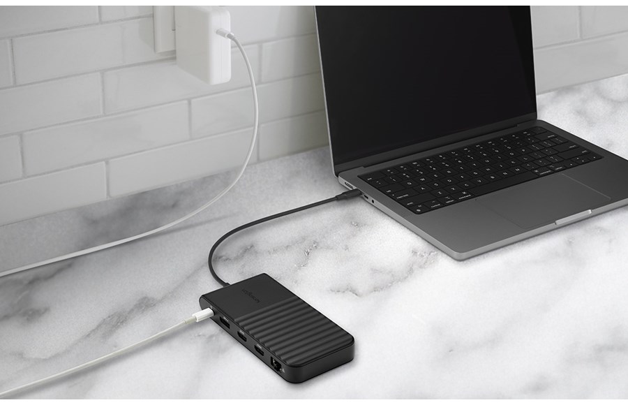 Laptop connected to an on-the-go Kensington USB-C mobile docking station.