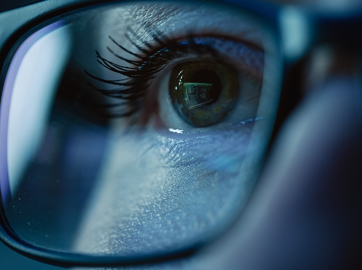 Up-close of person’s eye wearing glasses.