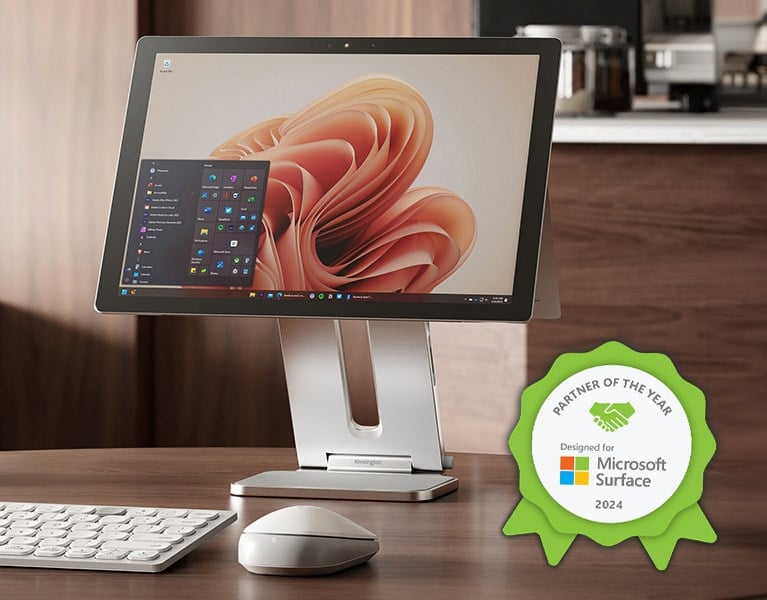 Laptop connected to several devices thanks to a kensington dock designed for microsoft surface and the Microsoft surface partner of the year badge.