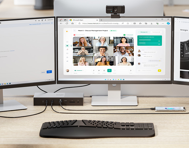 Professional setup in the office featuring a Kensington SD5000T5 EQ Thunderbolt Docking Station, 3 monitors, and the Pro Fit Ergo keyboard.